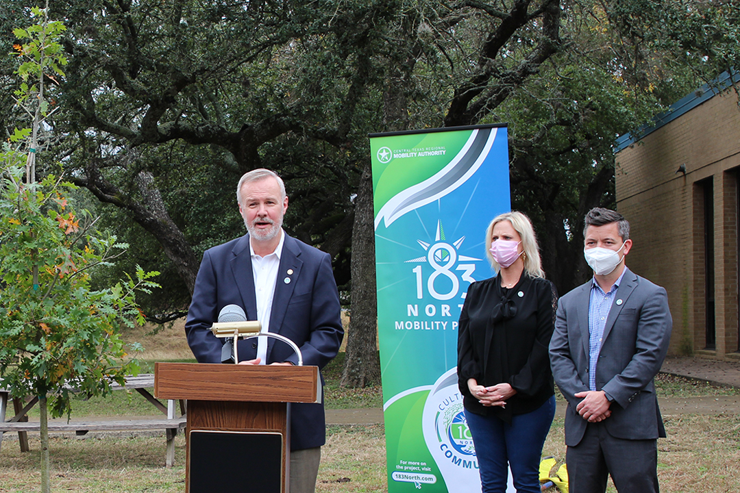 James M. Bass, Executive Director of the Central Texas Regional Mobility Authority, stands at a podium.